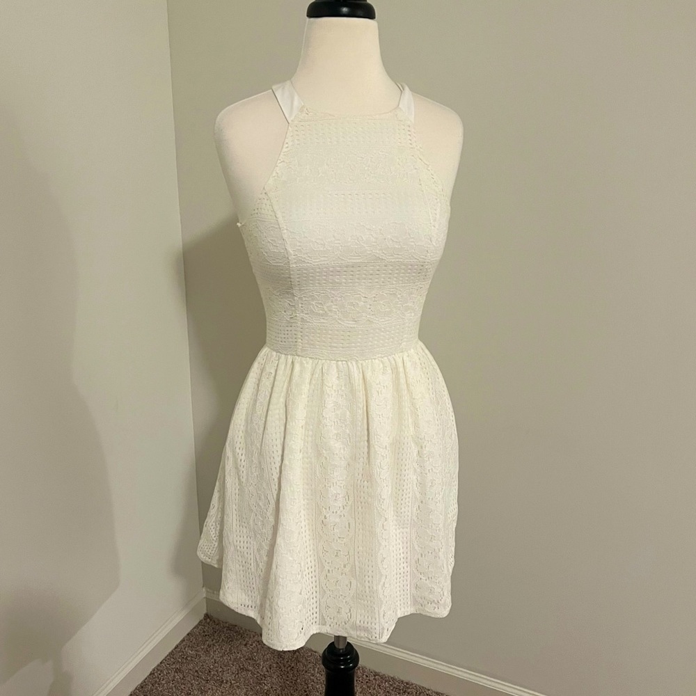 Aqua white laced dress with tags attached. Never worn.